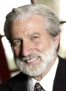 portrait of gray haired man with beard smiling