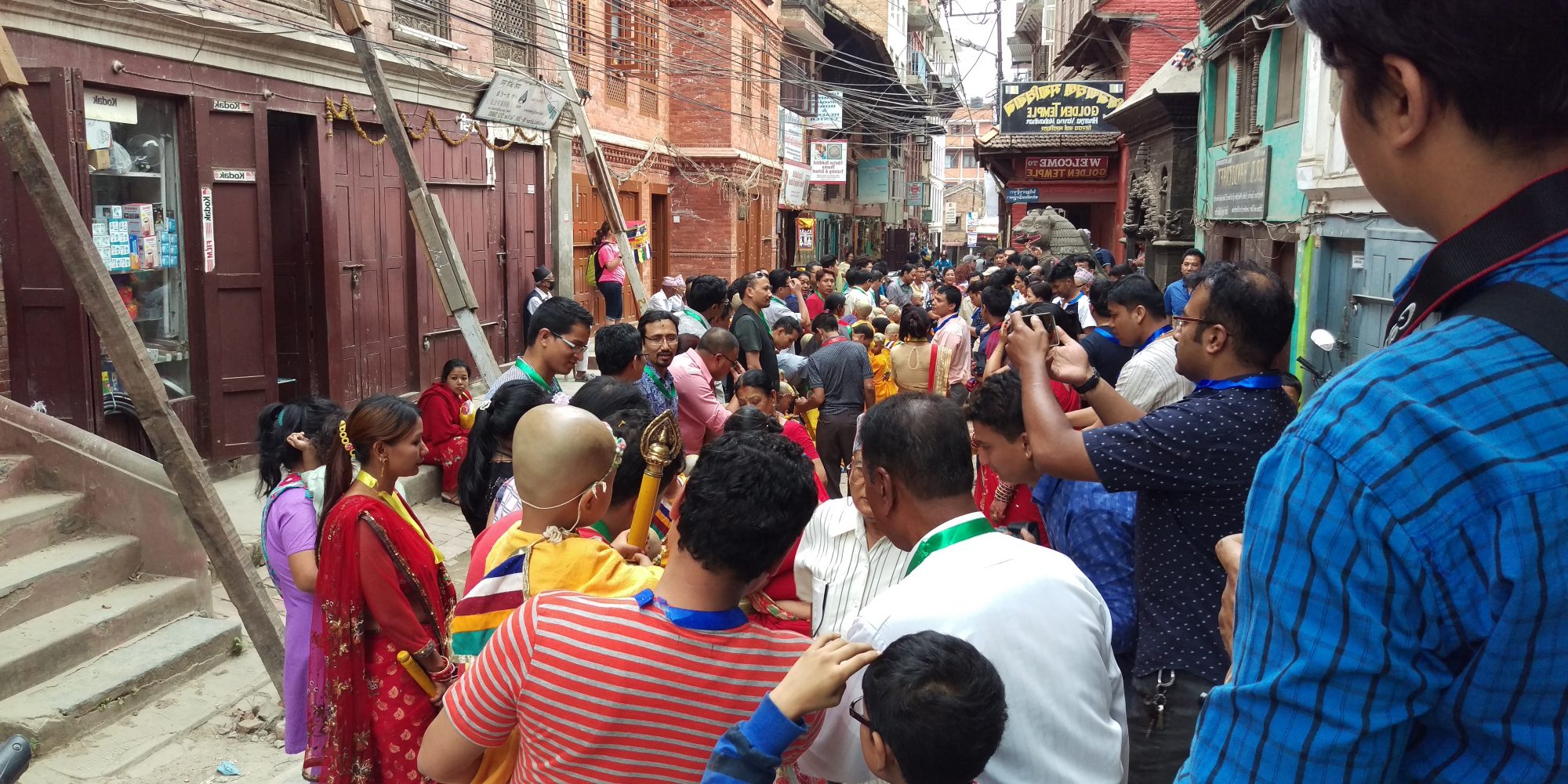 crowd of people in narrow street