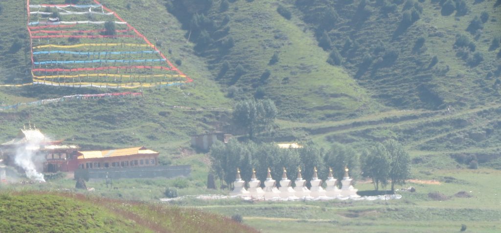 The eight stupas in front of Gonsar Monastery.