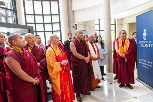 Karmapa with entourage of monks at University of Toronto