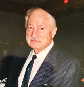 photo of older man in pinstripe suit