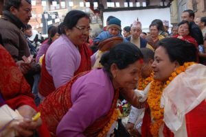 nepalese women talking to each other in crowd
