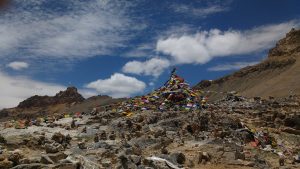 mound covered in prayer flags
