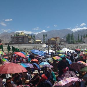 public gathering with mountains in distance