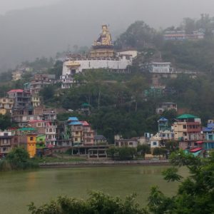 buddha statue on hill above village
