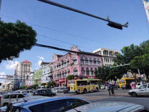 busy street and colorful buildings in mandalay