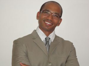 portrait of man in suit smiling